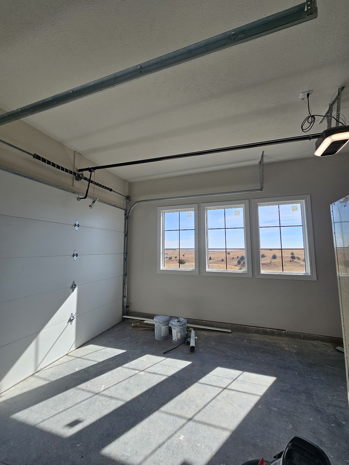 Freshly painted garage interior looking out to the prairie