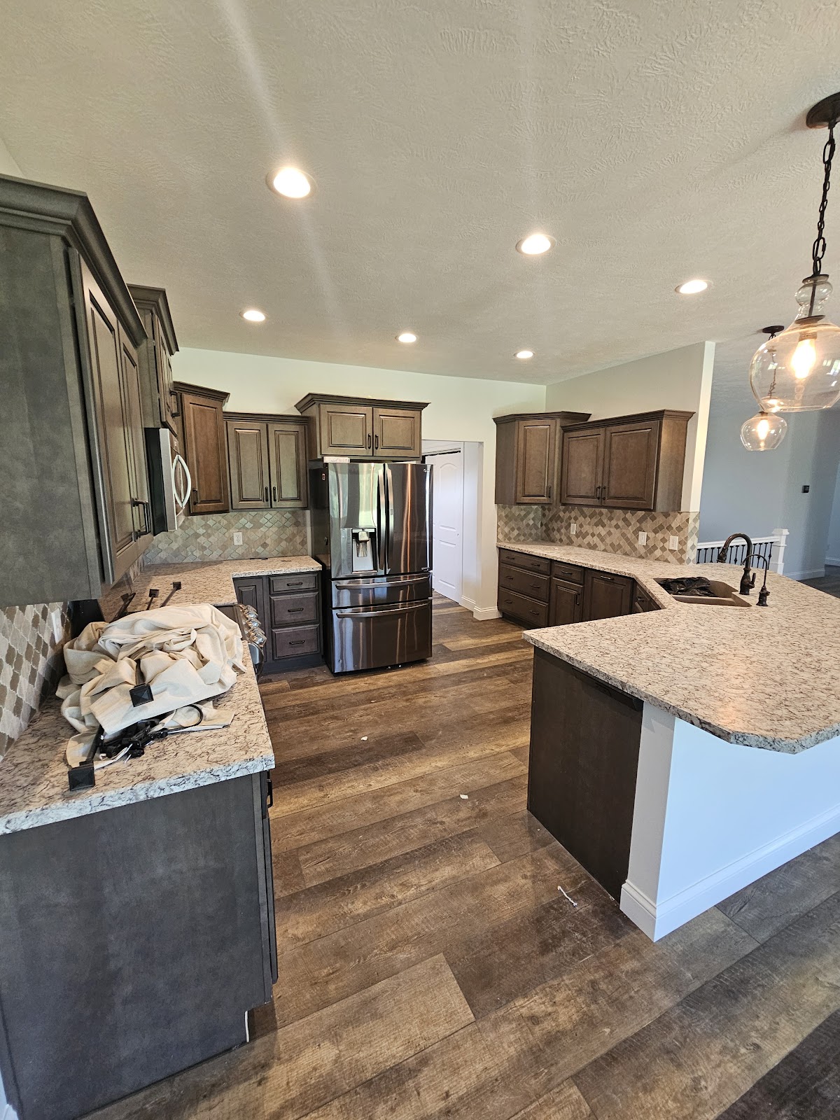 Kitchen with dark cabinets during a painting job