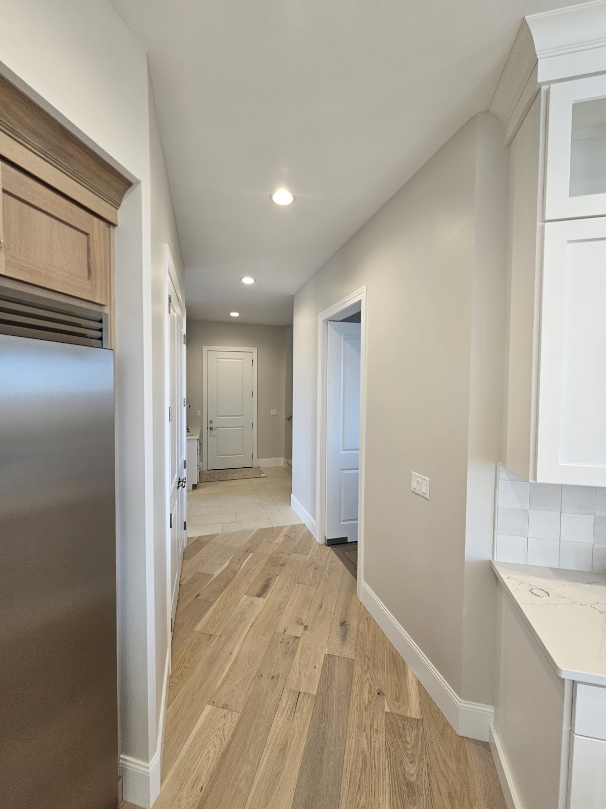 Hallway with clean white trim and doors